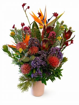 Beautiful large native Australian arrangement in a ceramic vase, designed with fresh seasonal flowers for a natural and elegant look.Fresh flower florist in Ringwood-Melbourne offering local delivery.